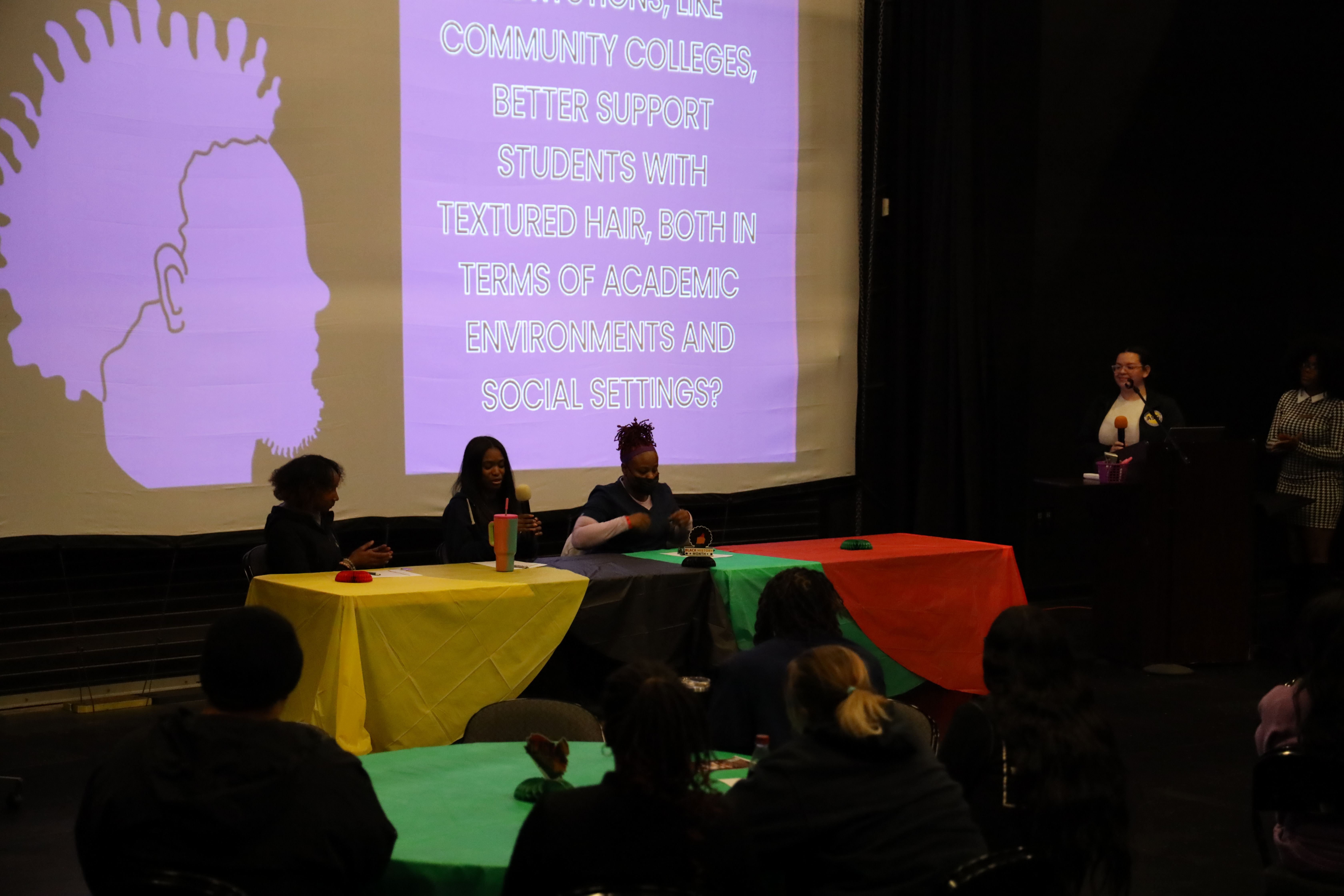 A cosmetology student speaking on a women-centered student panel